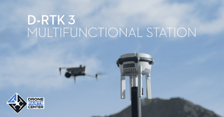 D-RTK 3 multifunctional station with drone flying in the background, mountains visible.