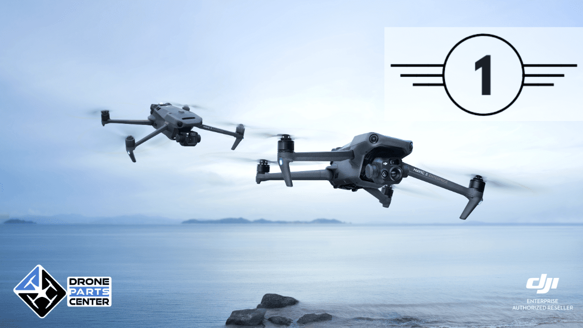 Two drones fly over the ocean.