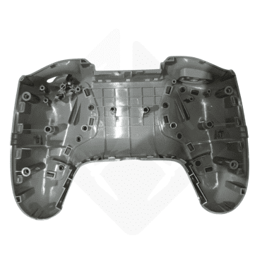 Inside view of an empty gray game controller shell, showcasing internal cutouts and screw holes.